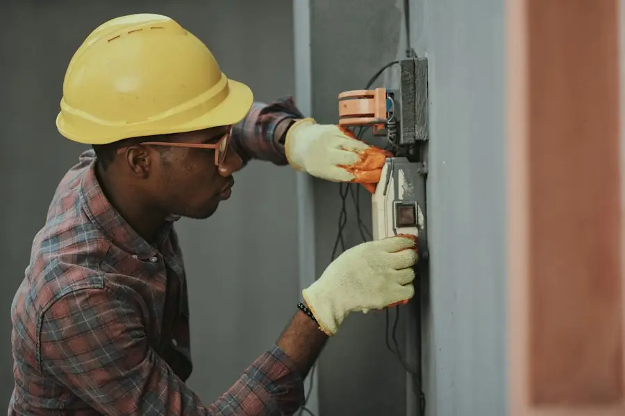 Engineer in a hard hat working on equipment